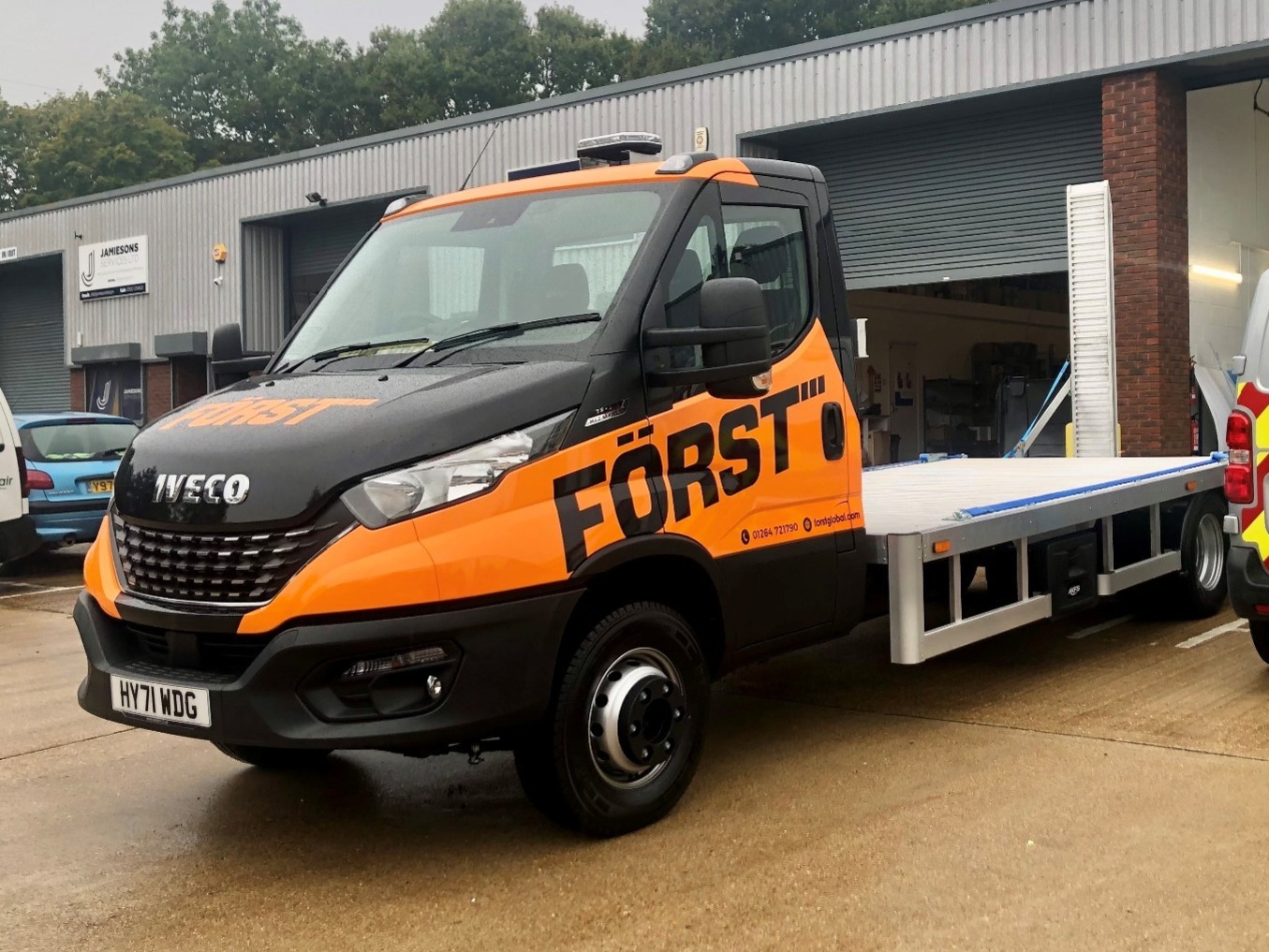 Orange and black full wrap on iveco daily