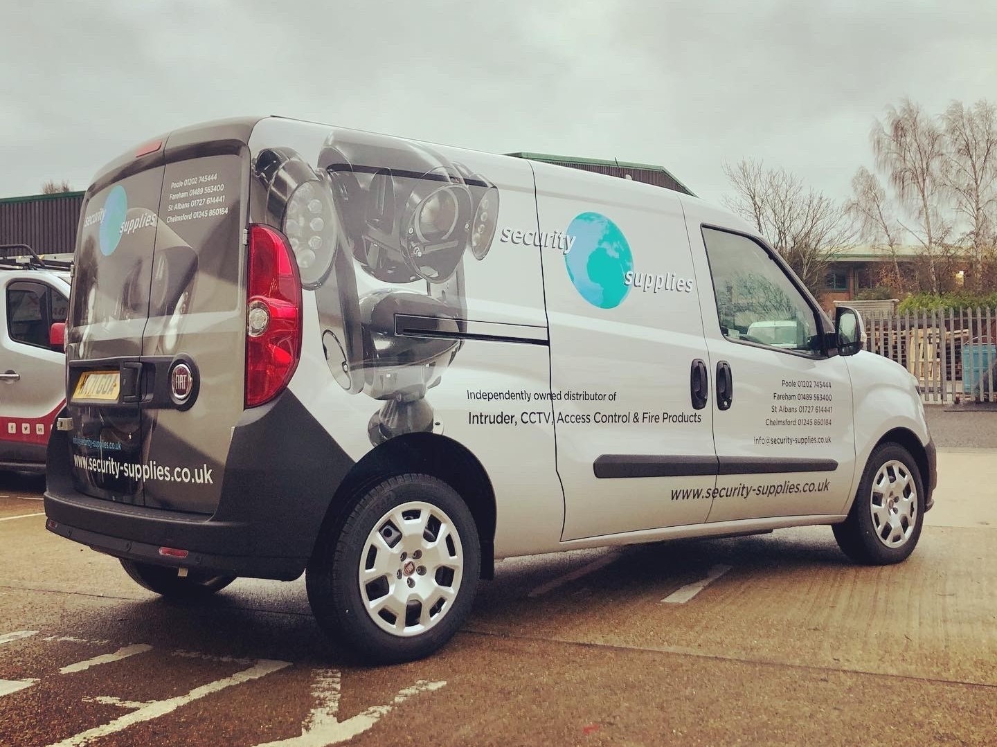 Digitally printed rear wrap with cut contour images and graphics